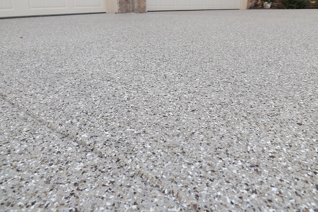 Polyaspartic top coat and flake on a driveway